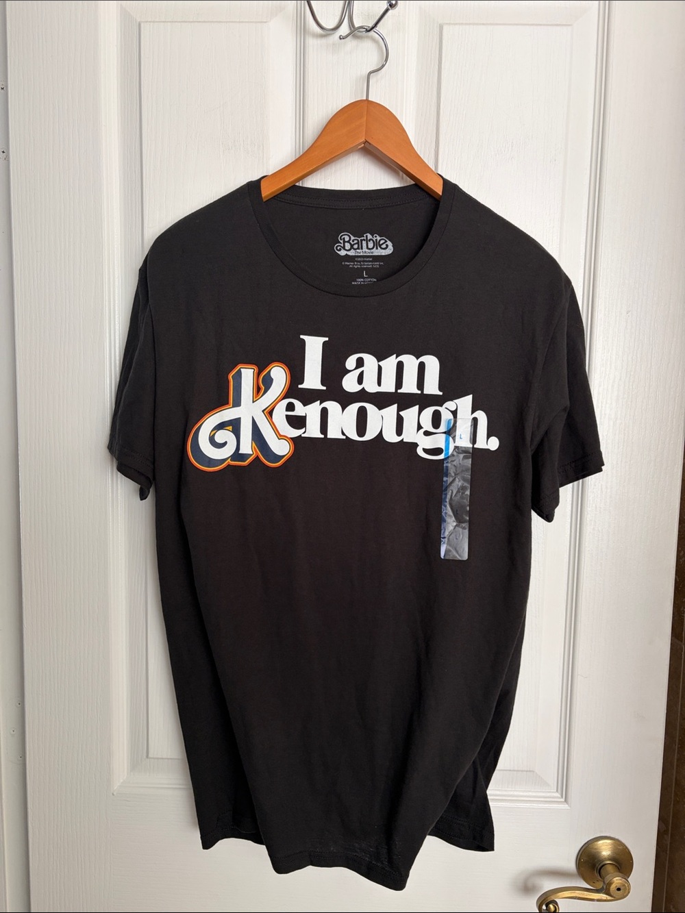 Barbie Black Graphic 'I Am Kenough. ' Short Sleeve Tee with Orange Accent